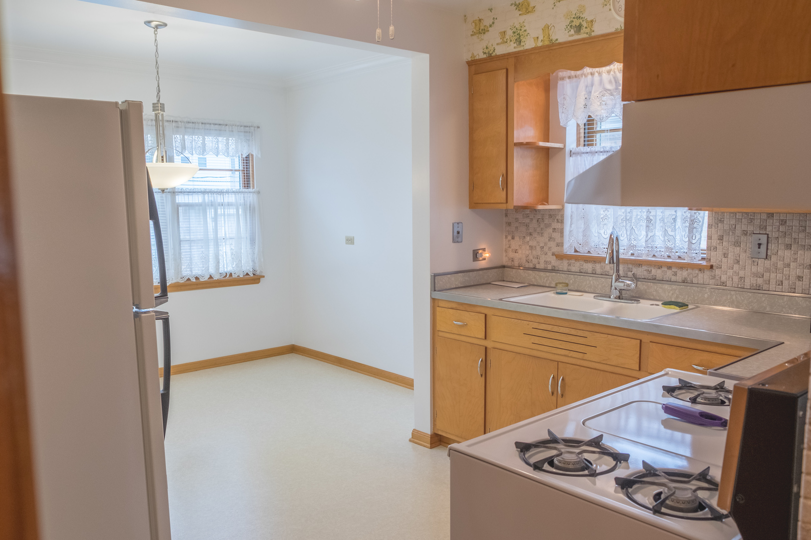 9016 West 23rd Street North Riverside, IL 60546 - Photo 13 of 49 a kitchen with stainless steel appliances granite countertop a sink stove and cabinets