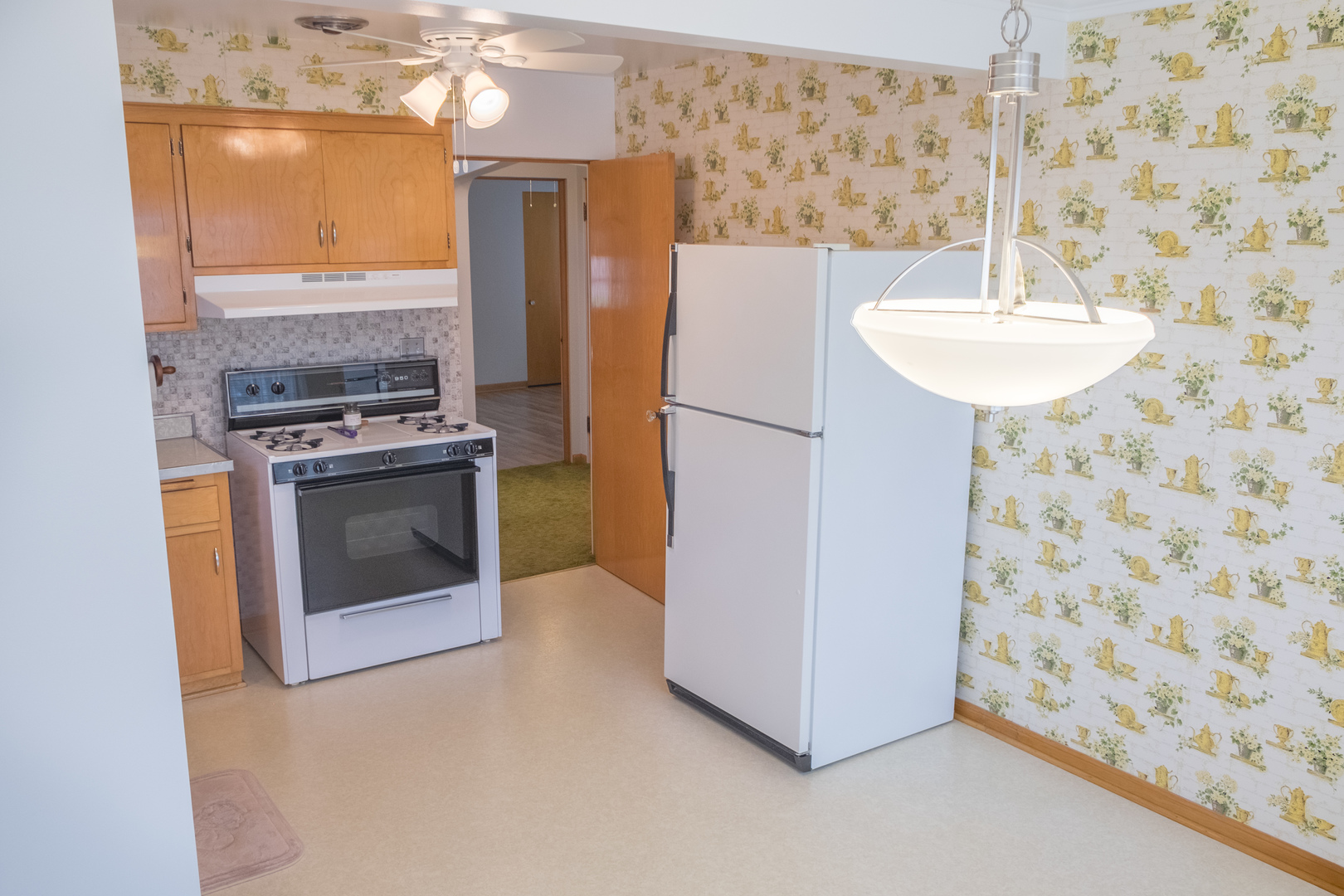 9016 West 23rd Street North Riverside, IL 60546 - Photo 14 of 49 a kitchen with a stove a refrigerator and a sink