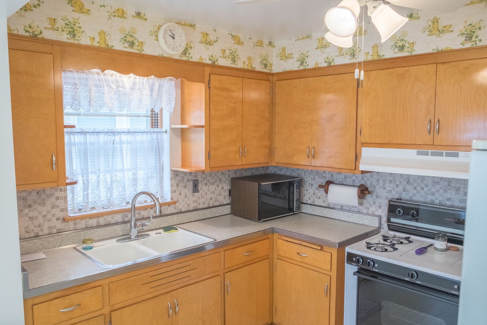 9016 West 23rd Street North Riverside, IL 60546 - Photo 17 of 49 a kitchen with stainless steel appliances a sink stove and cabinets