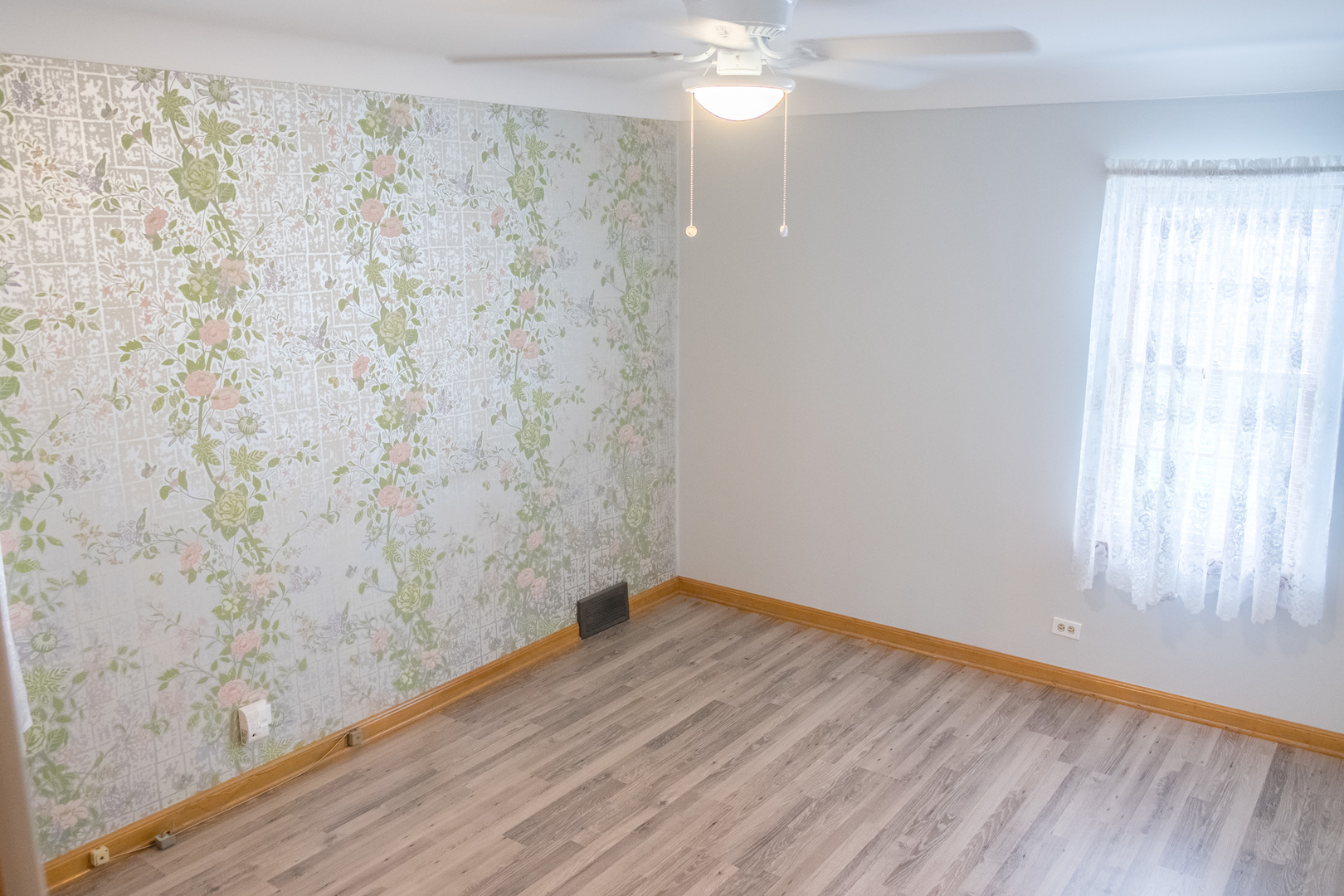 9016 West 23rd Street North Riverside, IL 60546 - Photo 18 of 49 a view of a room with wooden floor and fan
