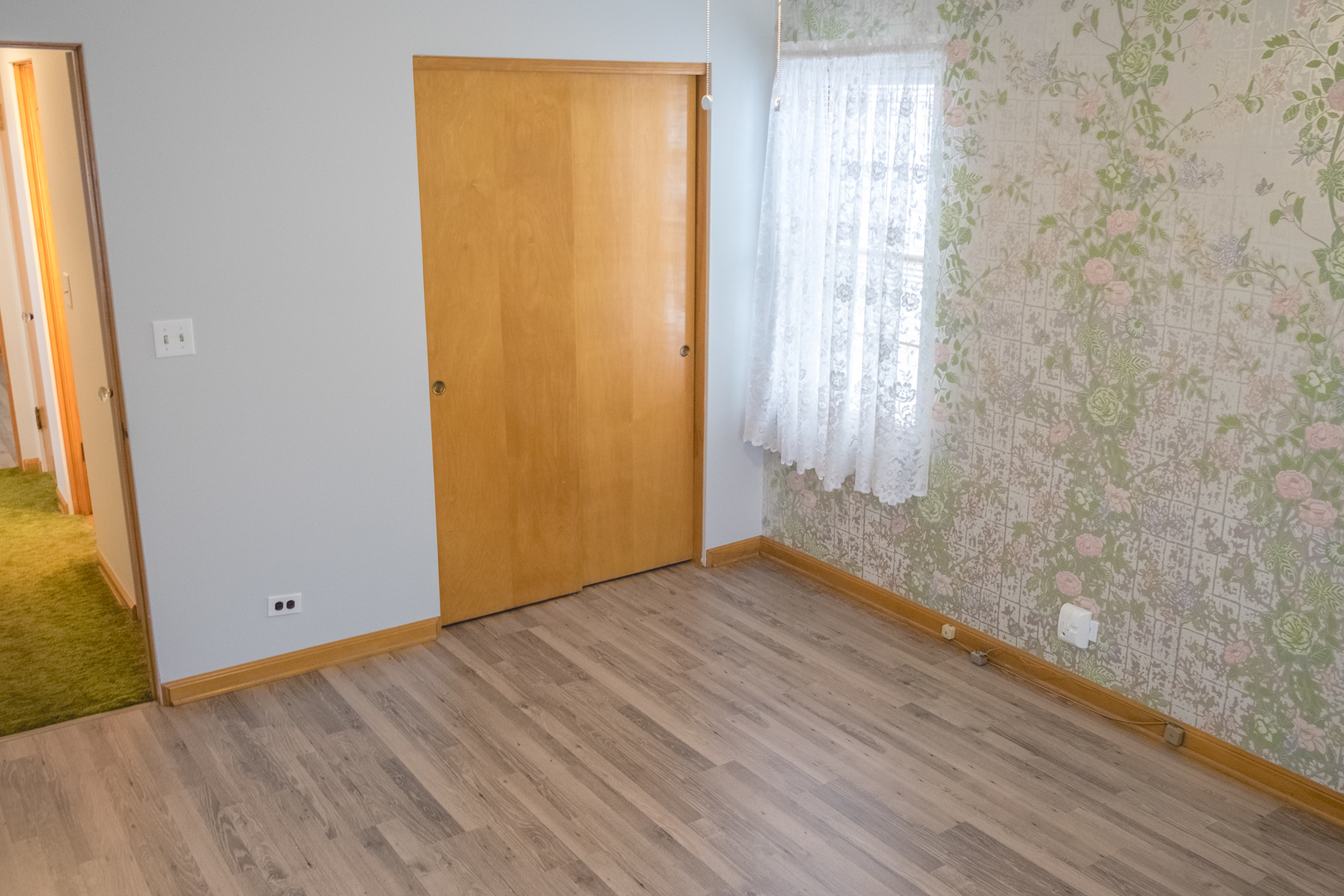 9016 West 23rd Street North Riverside, IL 60546 - Photo 20 of 49 an empty room with wooden floor and windows