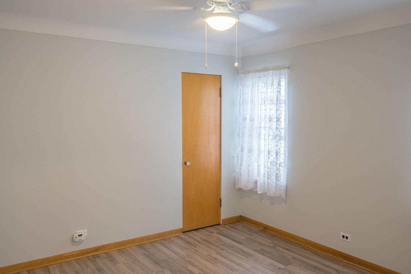 9016 West 23rd Street North Riverside, IL 60546 - Photo 25 of 49 an empty room with wooden floor and windows
