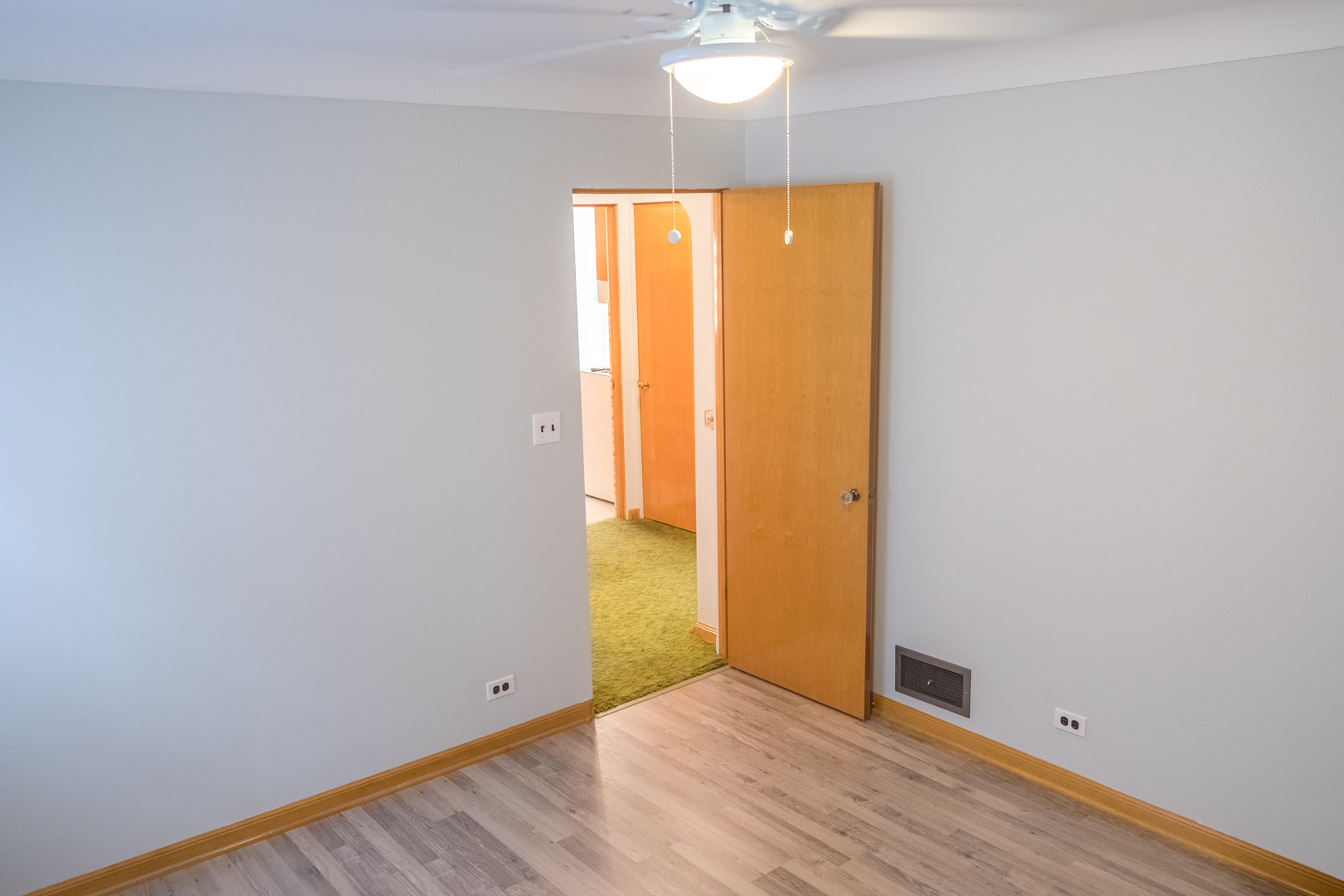 9016 West 23rd Street North Riverside, IL 60546 - Photo 26 of 49 an empty room with wooden floor and a window