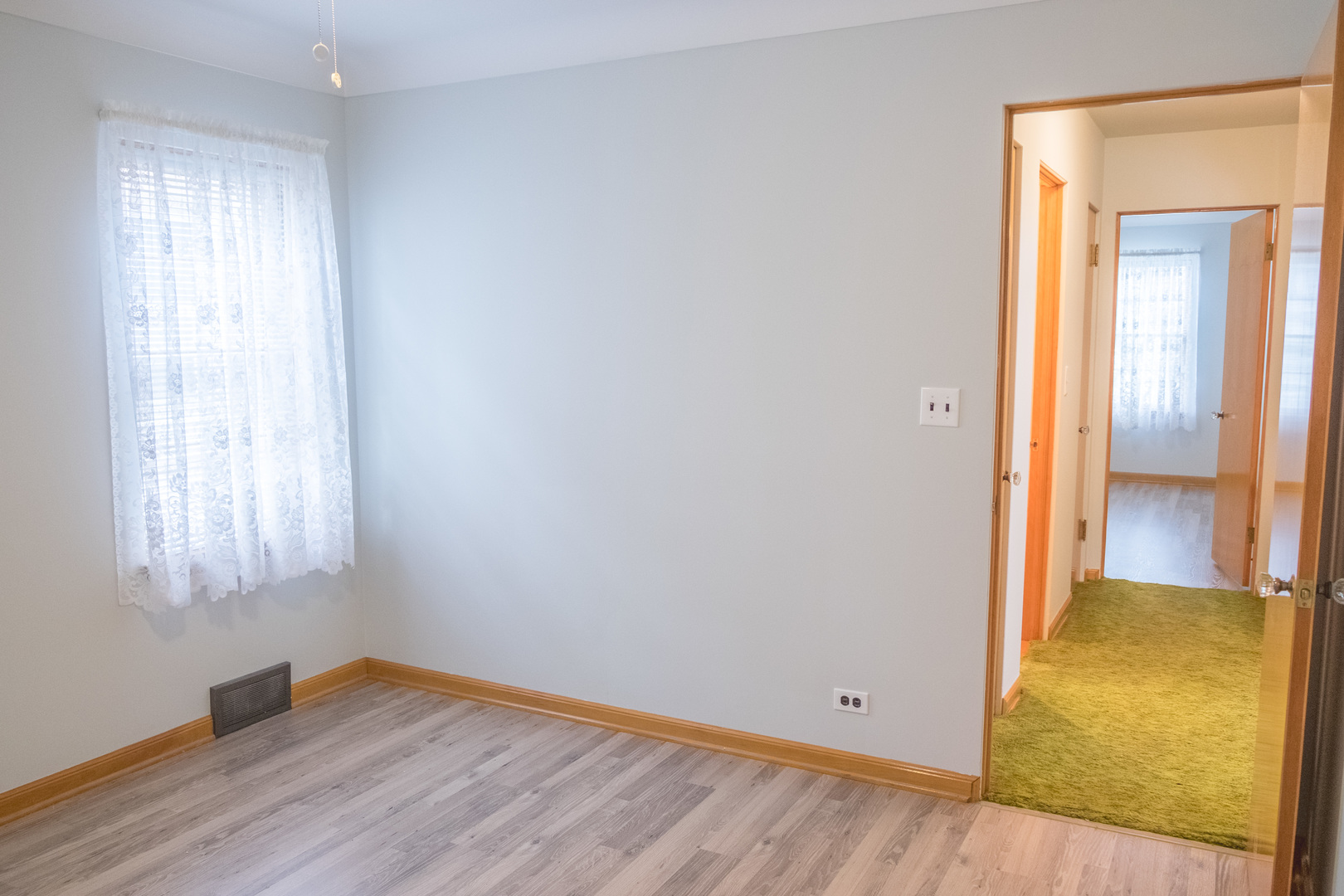 9016 West 23rd Street North Riverside, IL 60546 - Photo 28 of 49 an empty room with wooden floor and windows