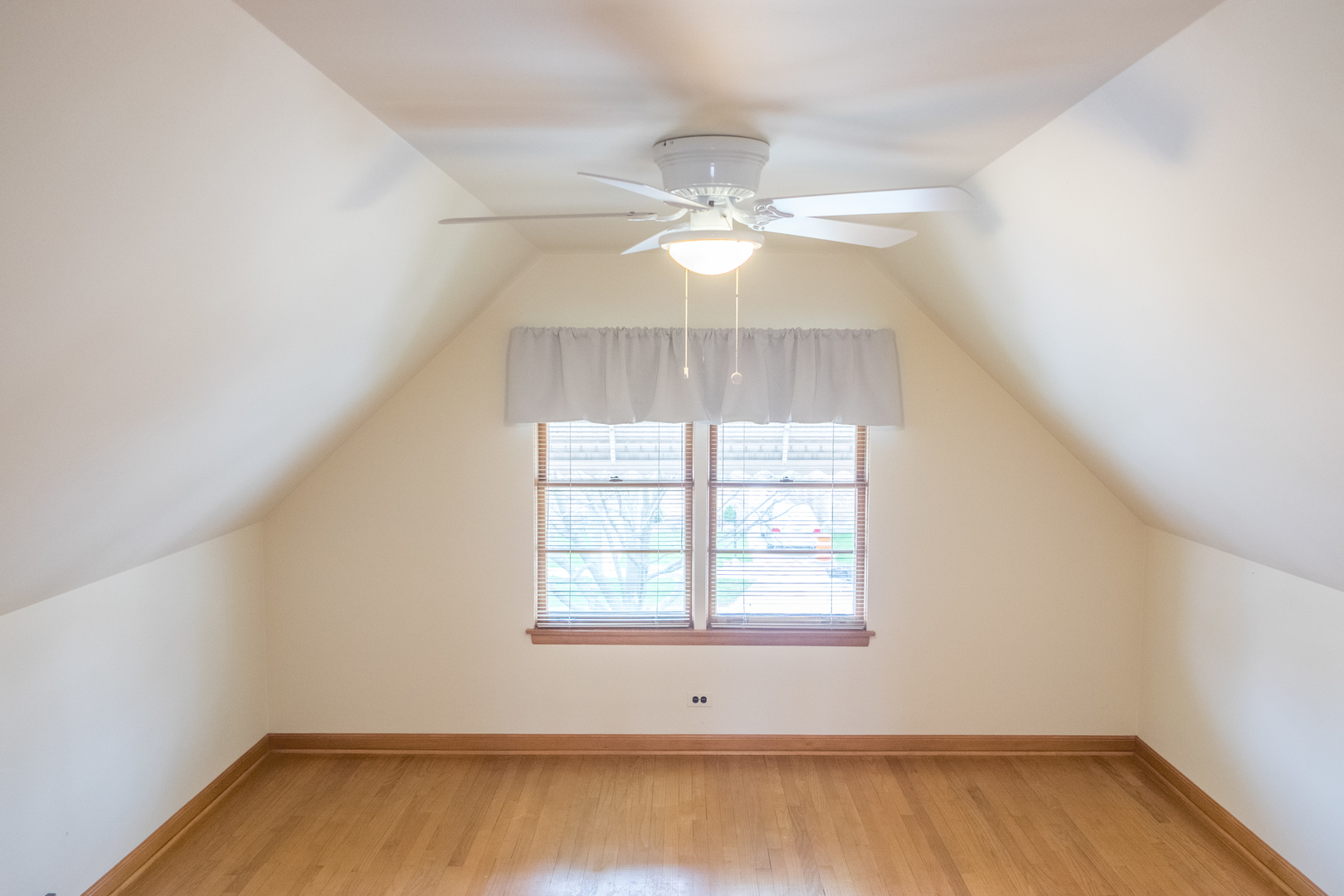 9016 West 23rd Street North Riverside, IL 60546 - Photo 31 of 49 an empty room with a window and a ceiling fan
