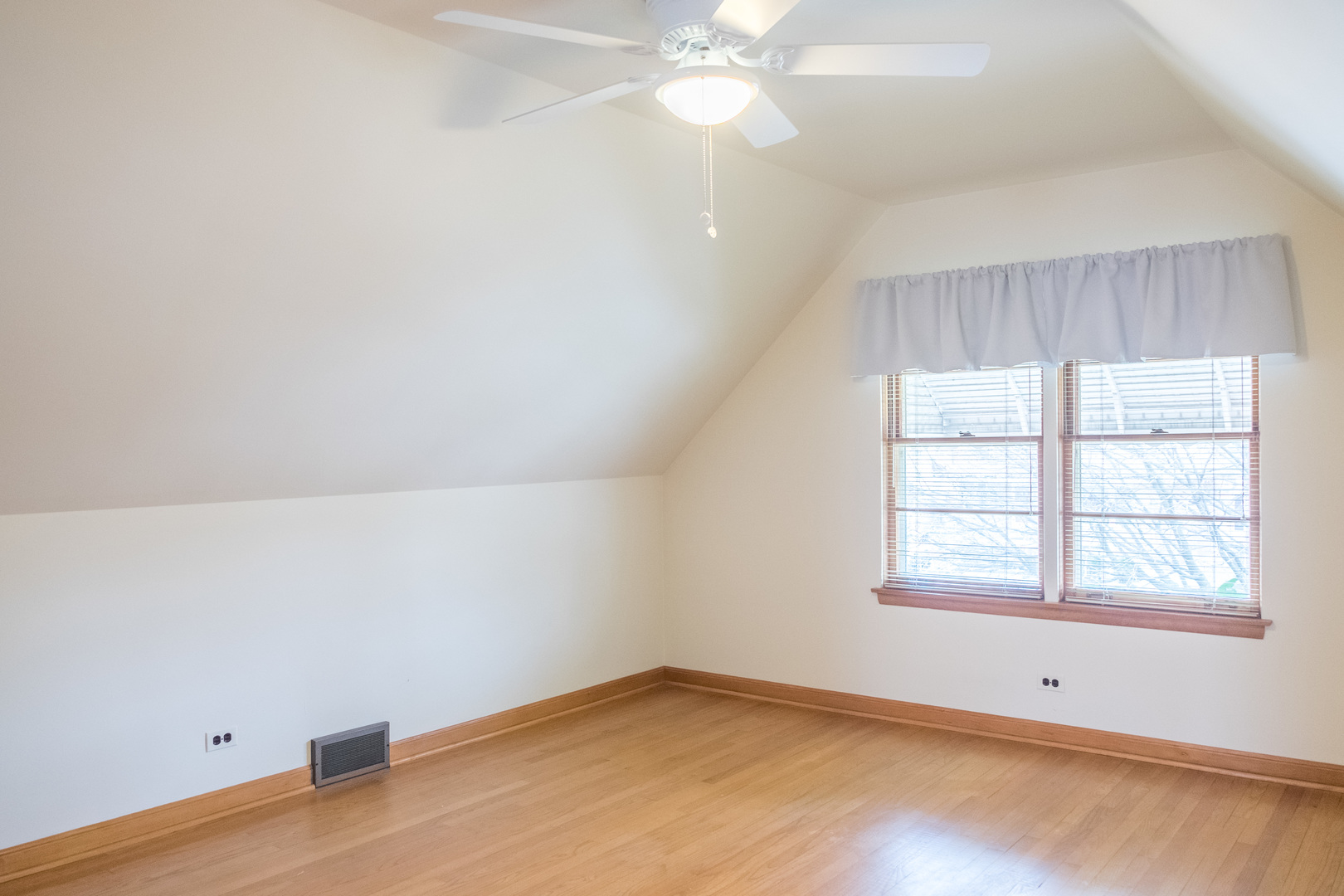 9016 West 23rd Street North Riverside, IL 60546 - Photo 32 of 49 an empty room with a window and a fan