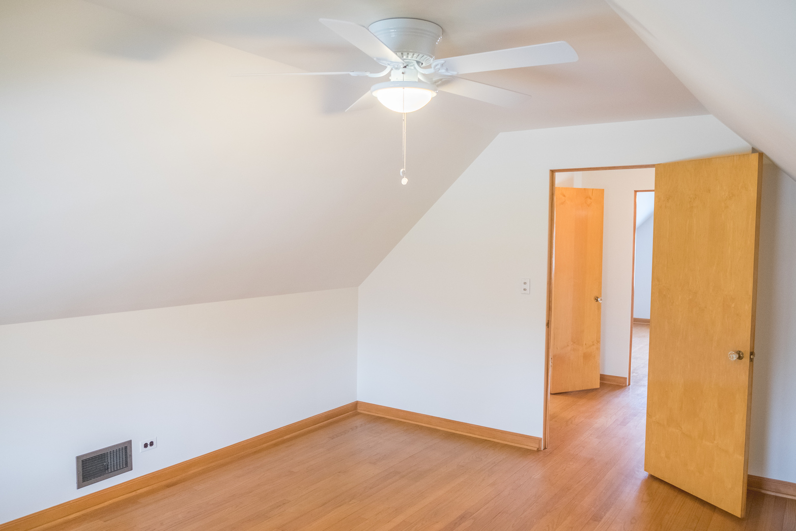 9016 West 23rd Street North Riverside, IL 60546 - Photo 33 of 49 an empty room with wooden floor and fan