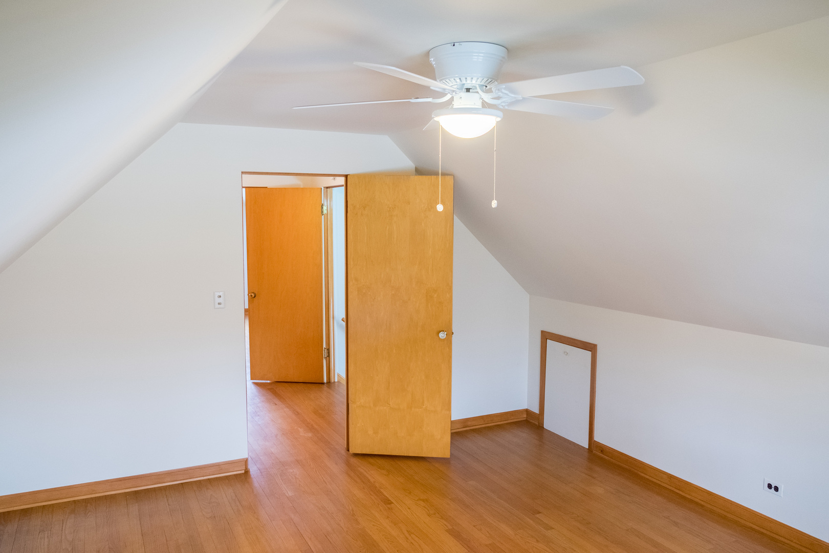 9016 West 23rd Street North Riverside, IL 60546 - Photo 34 of 49 a view of an empty room with wooden floor and a window