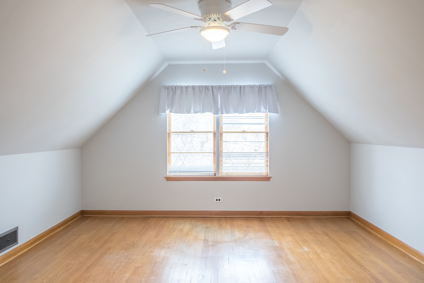 9016 West 23rd Street North Riverside, IL 60546 - Photo 36 of 49 an empty room with a window and a chandelier fan