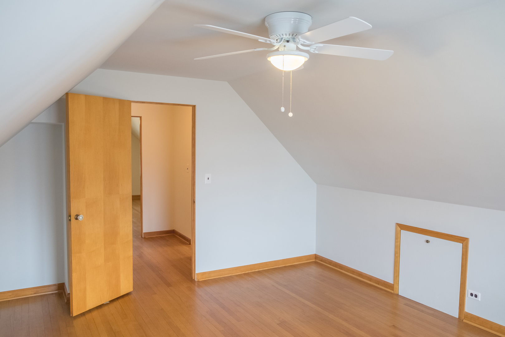 9016 West 23rd Street North Riverside, IL 60546 - Photo 38 of 49 an empty room with wooden floor fan and windows
