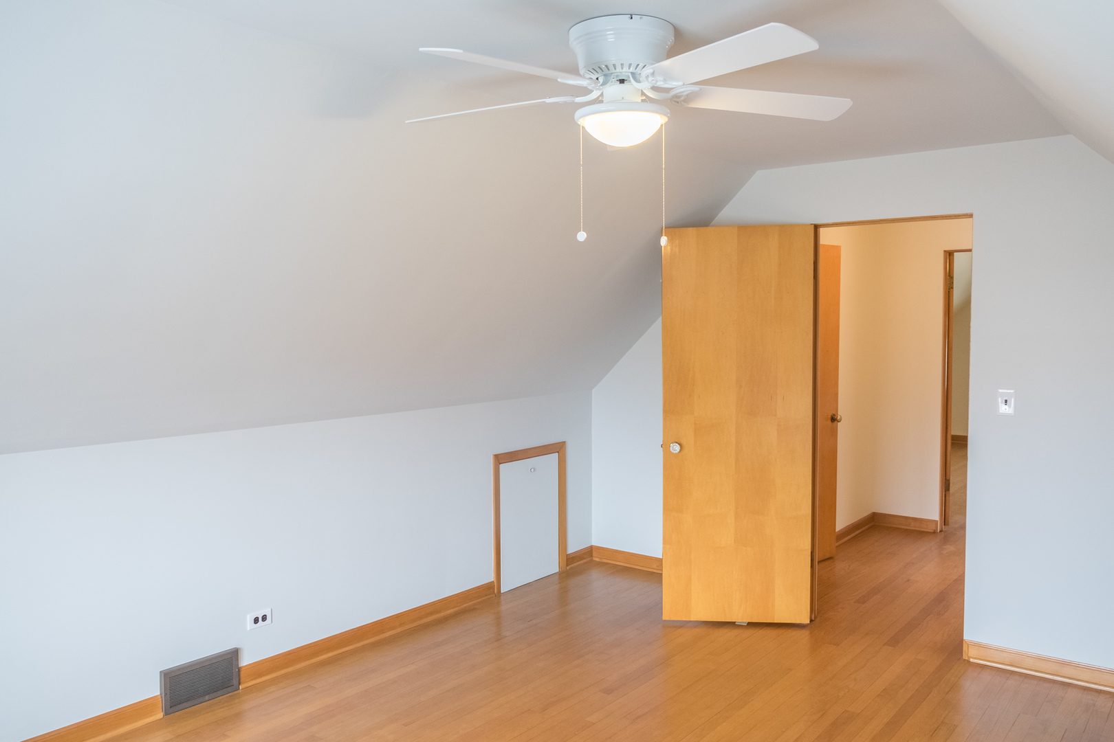 9016 West 23rd Street North Riverside, IL 60546 - Photo 39 of 49 a view of an empty room with wooden floor and a ceiling fan