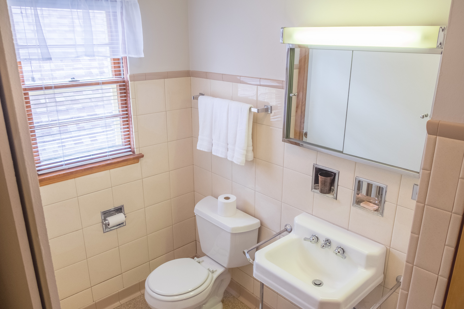 9016 West 23rd Street North Riverside, IL 60546 - Photo 42 of 49 a white toilet sitting next to a bathroom sink