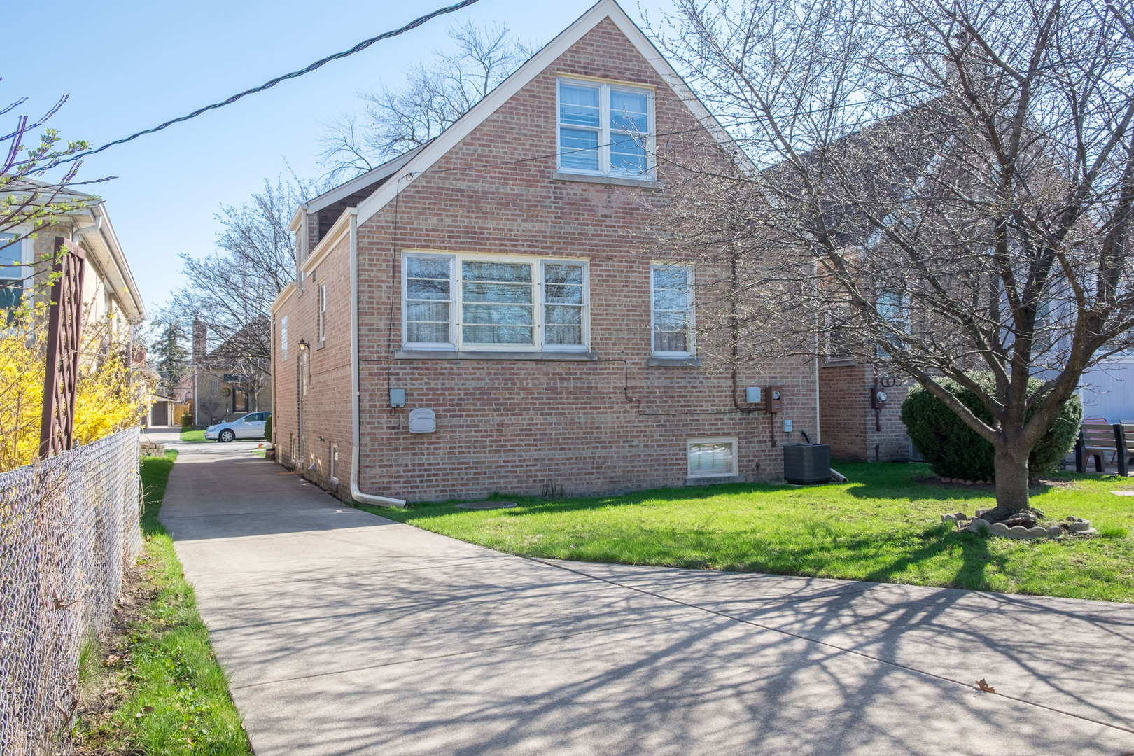 9016 West 23rd Street North Riverside, IL 60546 - Photo 7 of 49 a front view of a house with a yard and garage