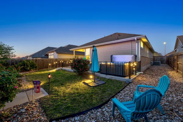 a view of a couches in patio of back yard