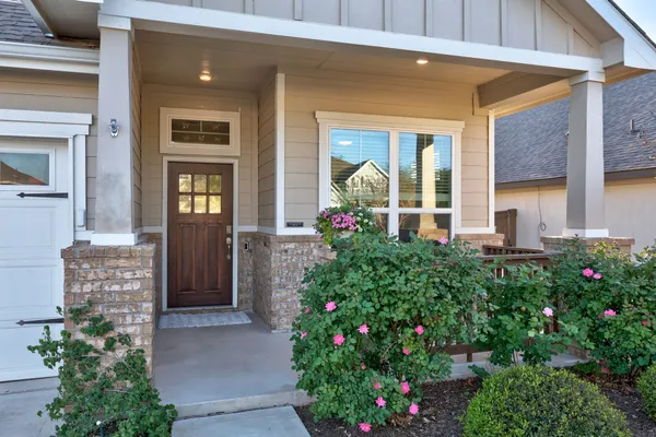 a front view of a house with an outdoor space