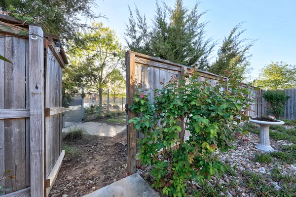 a view of a house with a backyard and garden