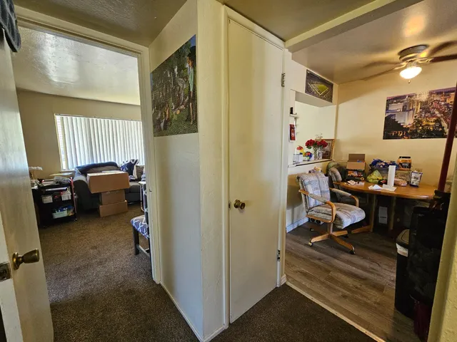 a view of a workspace with furniture and a workspace