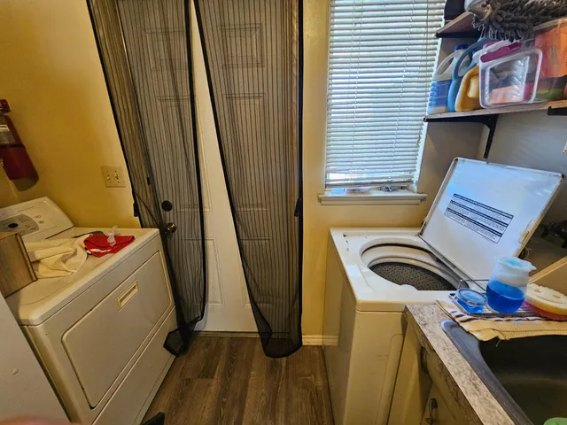 a view of a hallway with stairs