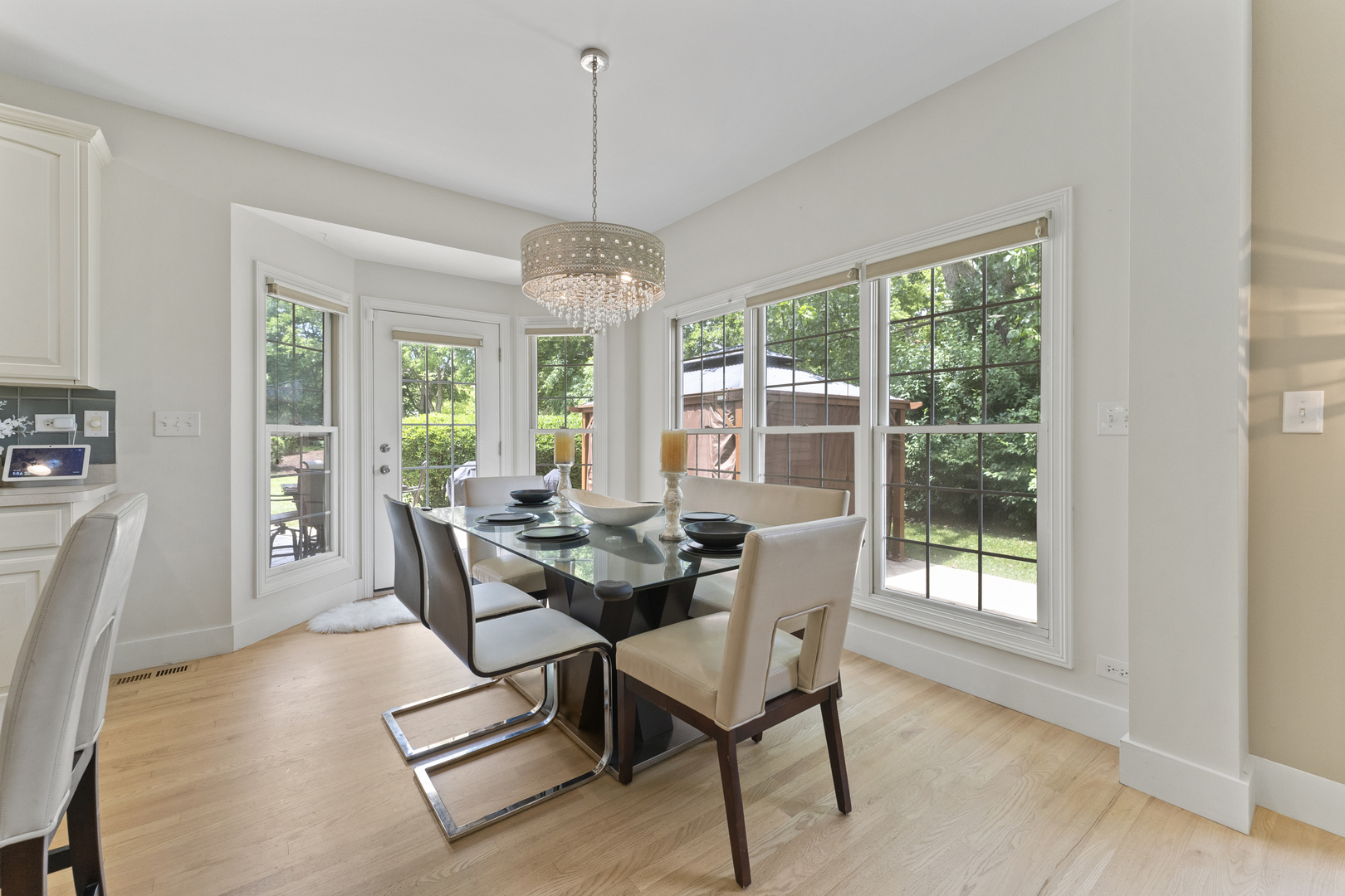 4308 Royal Windyne Court St. Charles, IL 60174 - Photo 13 of 47 a view of a dining room with furniture wooden floor and chandelier