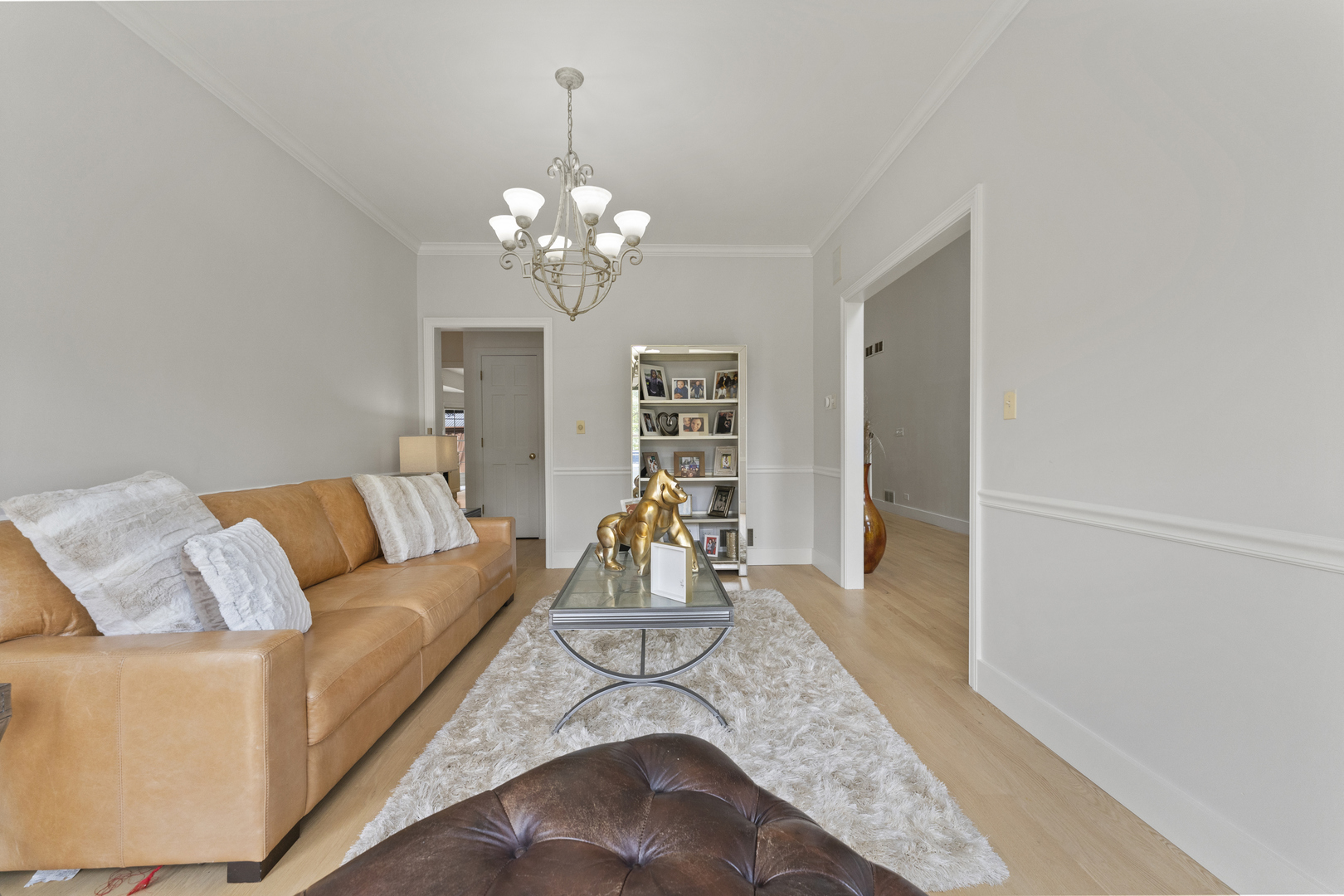 4308 Royal Windyne Court St. Charles, IL 60174 - Photo 17 of 47 a living room with furniture and a chandelier