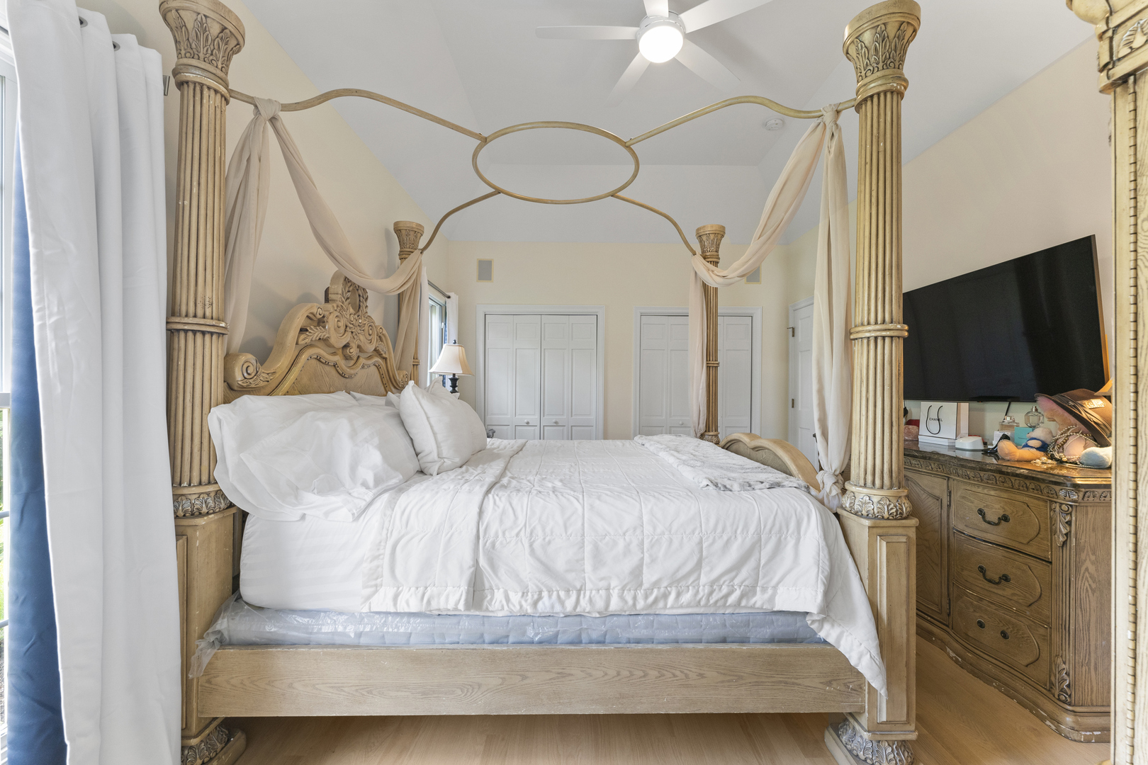 4308 Royal Windyne Court St. Charles, IL 60174 - Photo 21 of 47 a bedroom with a bed and a flat tv screen on dresser