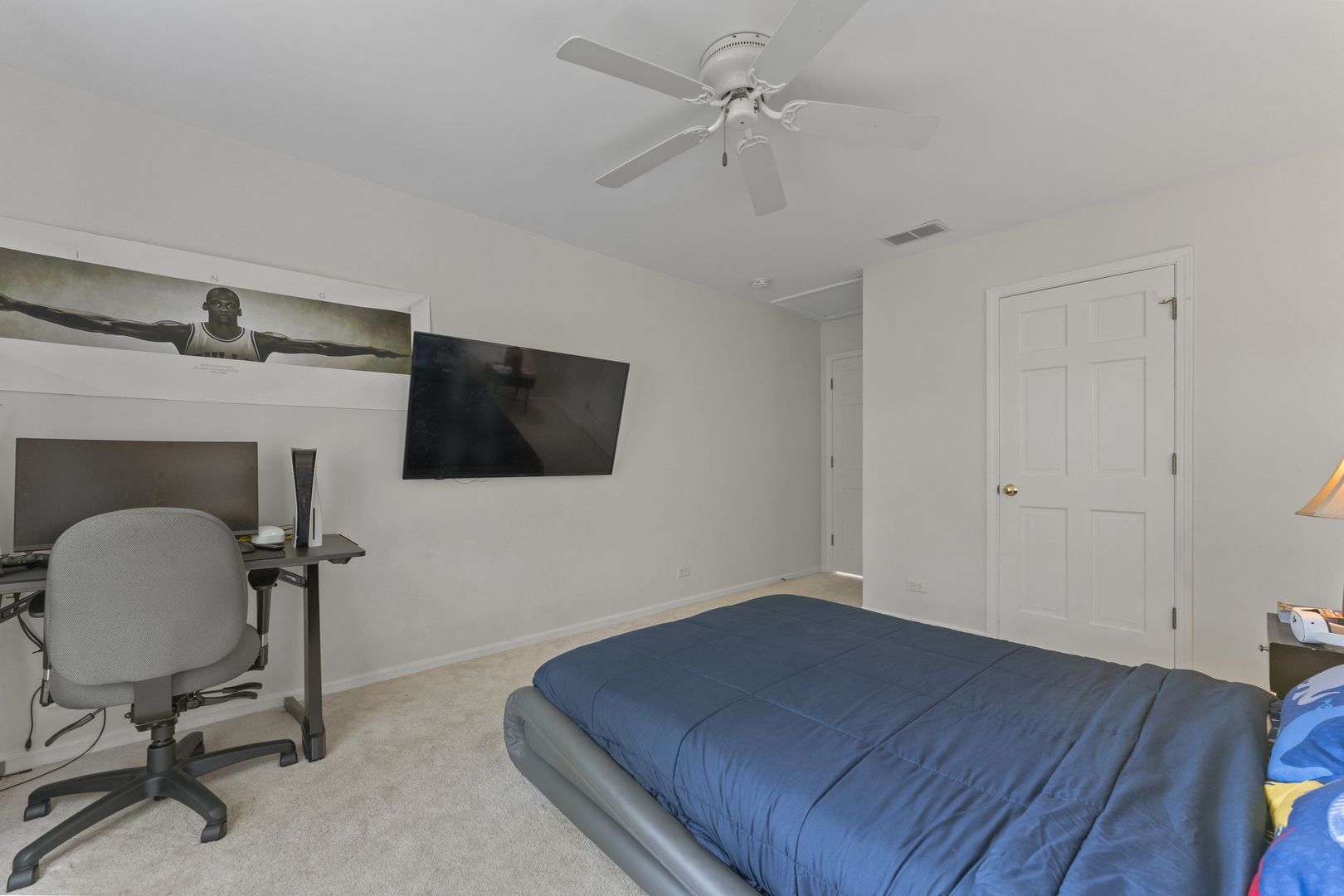 4308 Royal Windyne Court St. Charles, IL 60174 - Photo 27 of 47 a room with a chair and a flat screen tv