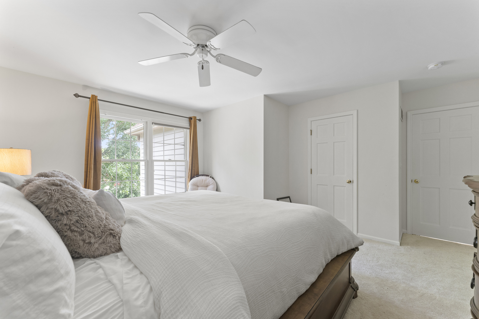 4308 Royal Windyne Court St. Charles, IL 60174 - Photo 29 of 47 a bedroom with a large bed and a window