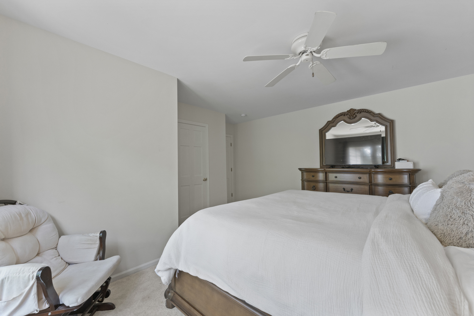 4308 Royal Windyne Court St. Charles, IL 60174 - Photo 30 of 47 a bedroom with a bed and a chair