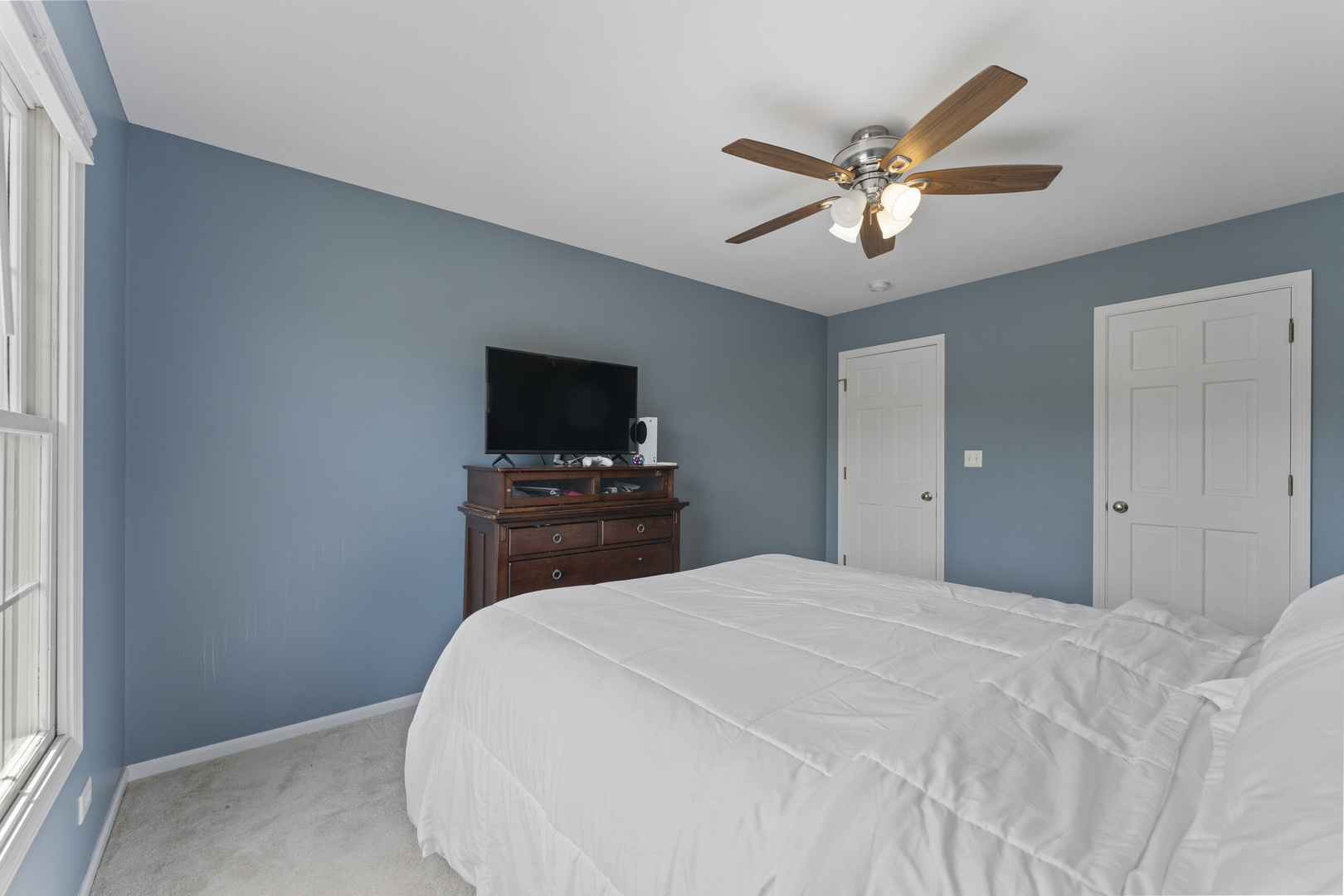 4308 Royal Windyne Court St. Charles, IL 60174 - Photo 33 of 47 a bedroom with a bed and a flat screen tv