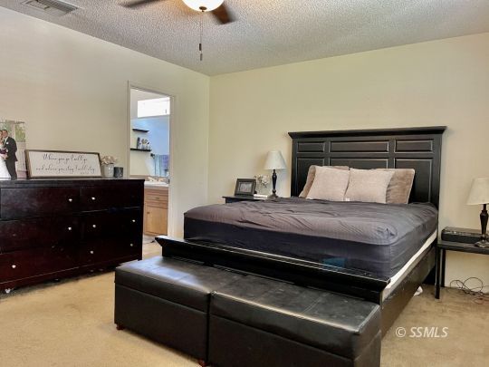 521 Scott Street Ridgecrest, CA 93555 - Photo 20 of 33 a bedroom with a bed and a dresser