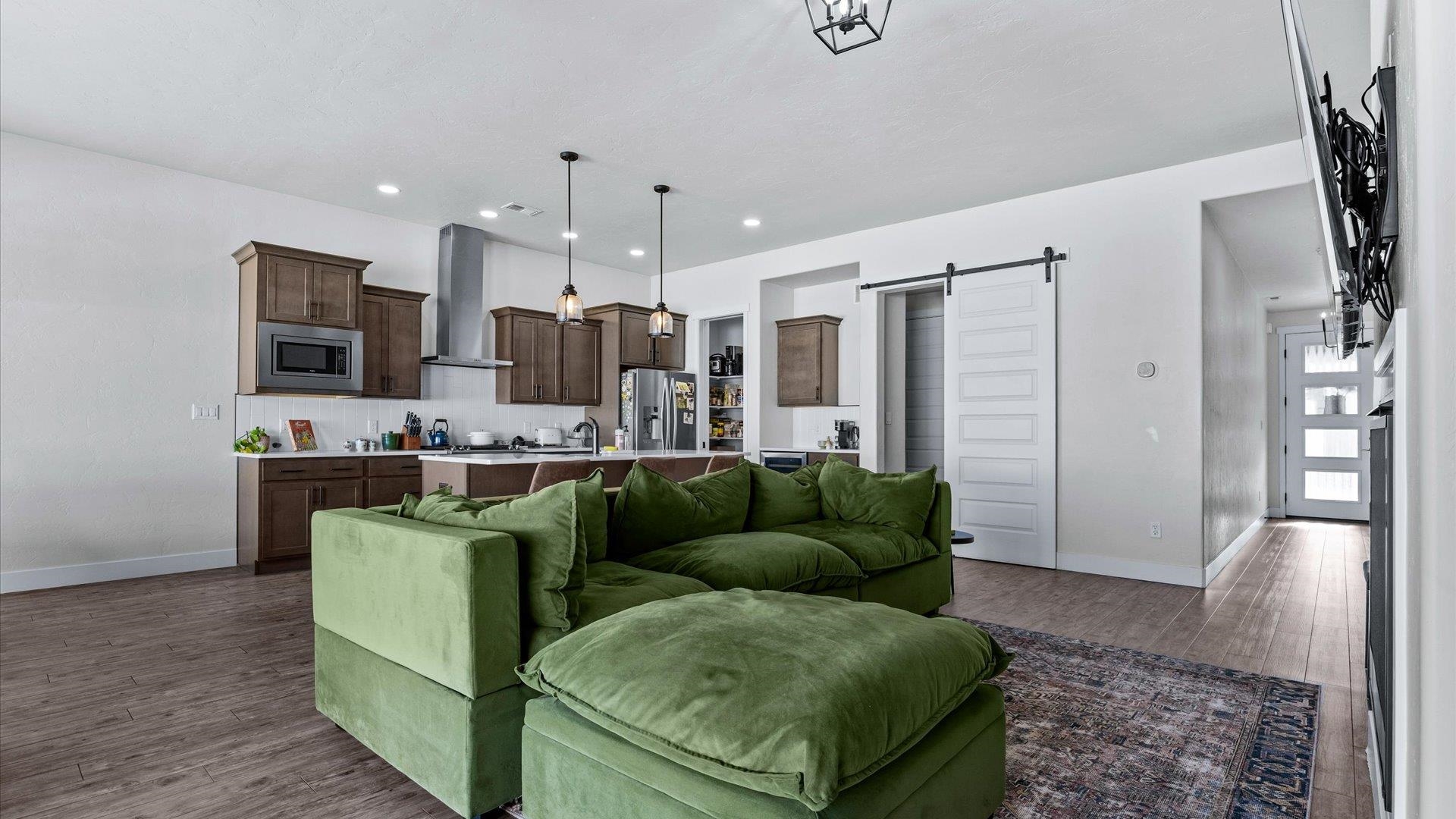840 Rupp Avenue Palisade, CO 81526 - Photo 6 of 27 a living room with furniture and a wooden floor