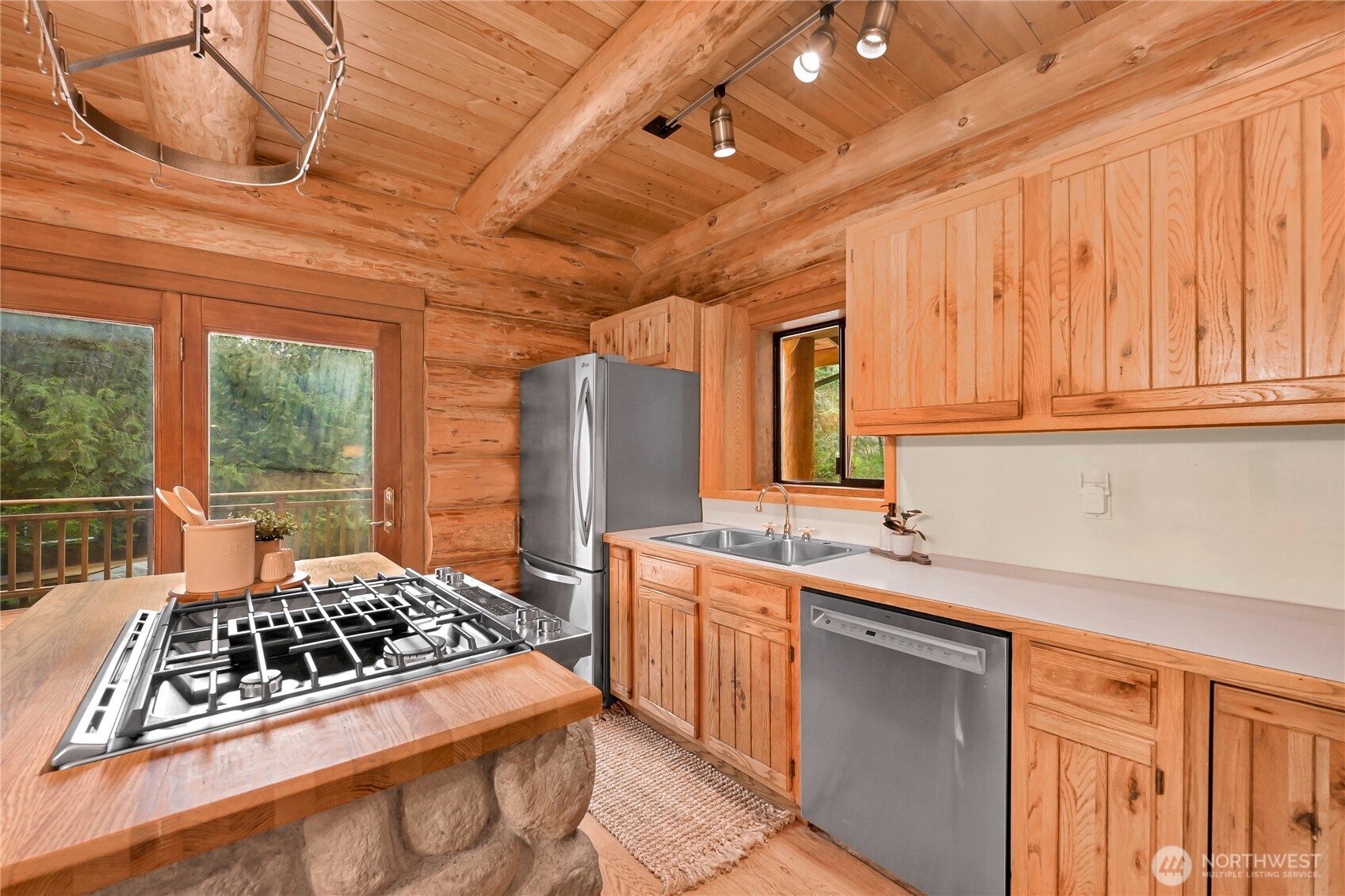 498 Summerland Road Bellingham, WA 98229 - Photo 14 of 40 a kitchen with sink a stove and refrigerator