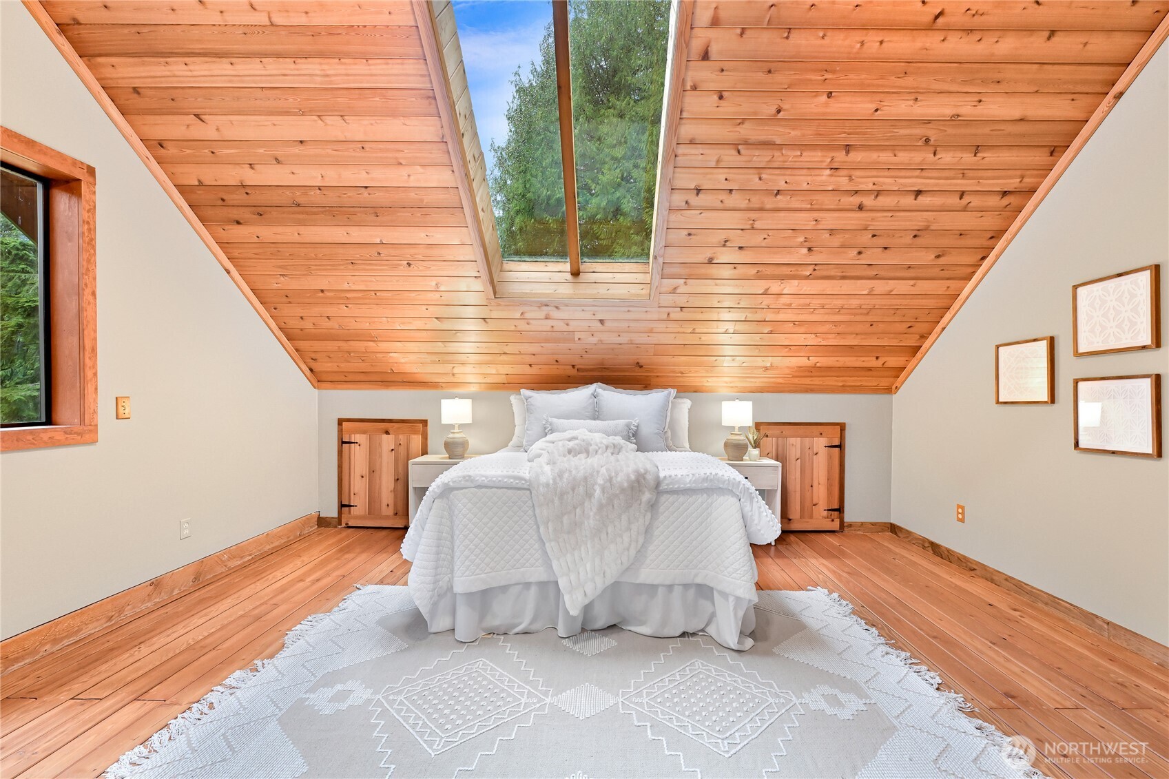 498 Summerland Road Bellingham, WA 98229 - Photo 20 of 40 a white house with a large window and wooden floor