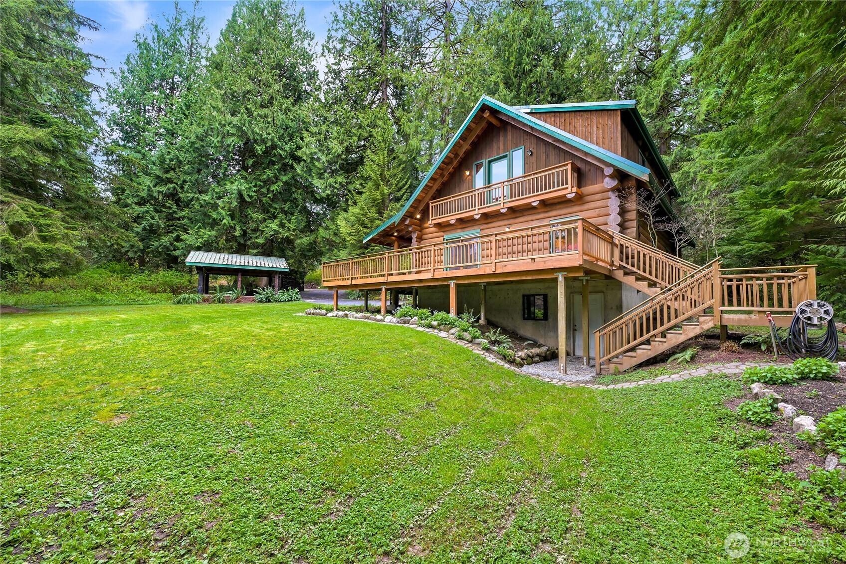 498 Summerland Road Bellingham, WA 98229 - Photo 2 of 40 a view of a house with a yard and sitting area