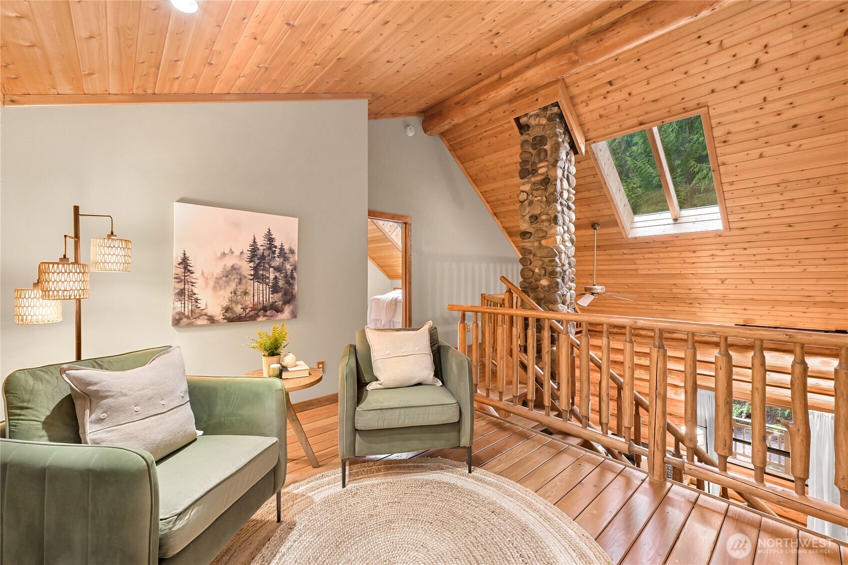 498 Summerland Road Bellingham, WA 98229 - Photo 23 of 40 a living room with furniture and a floor to ceiling window