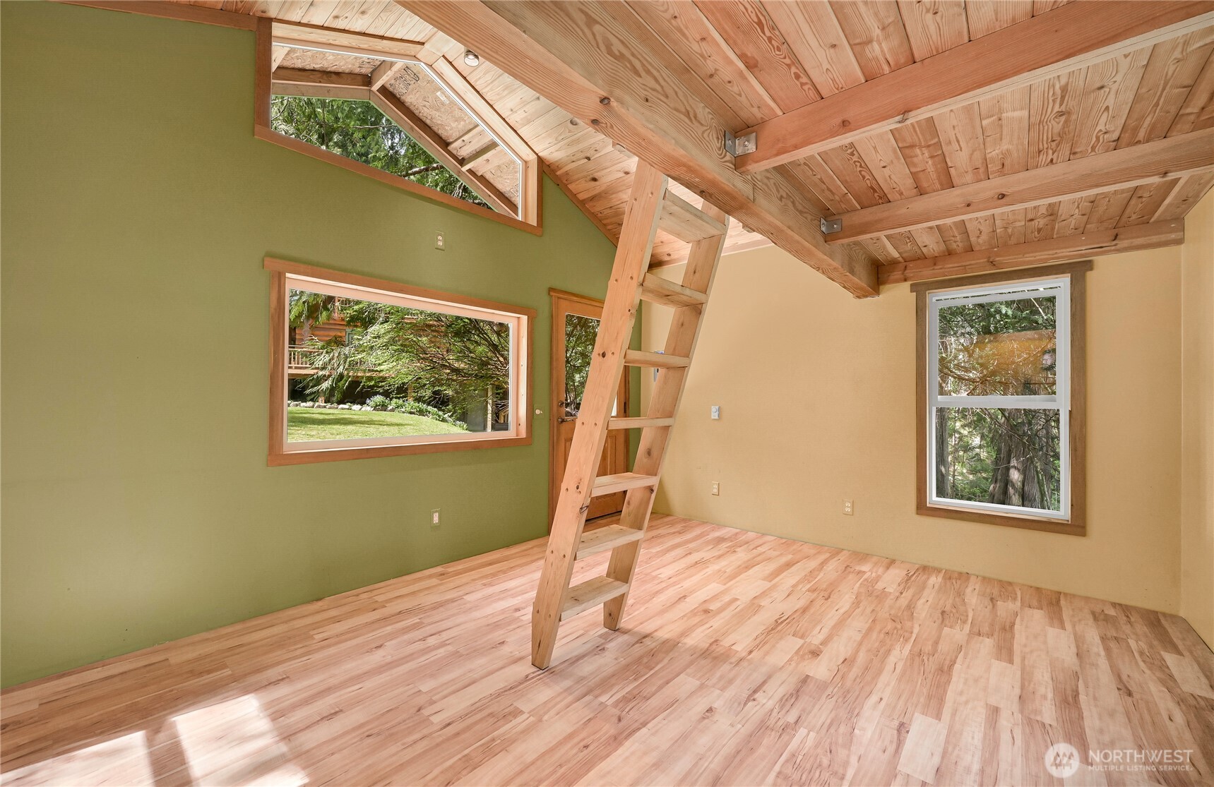 498 Summerland Road Bellingham, WA 98229 - Photo 31 of 40 a view of an empty room with wooden floor and a window