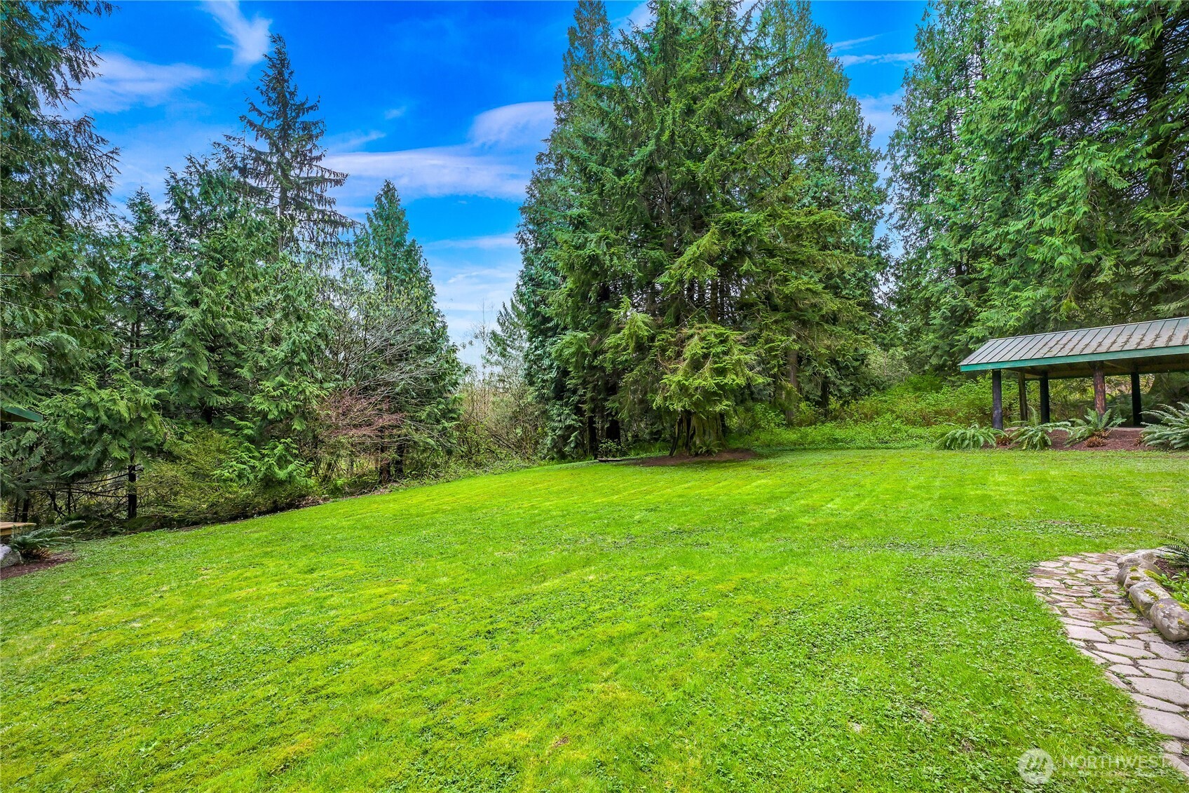 498 Summerland Road Bellingham, WA 98229 - Photo 33 of 40 a view of a house with backyard and a garden