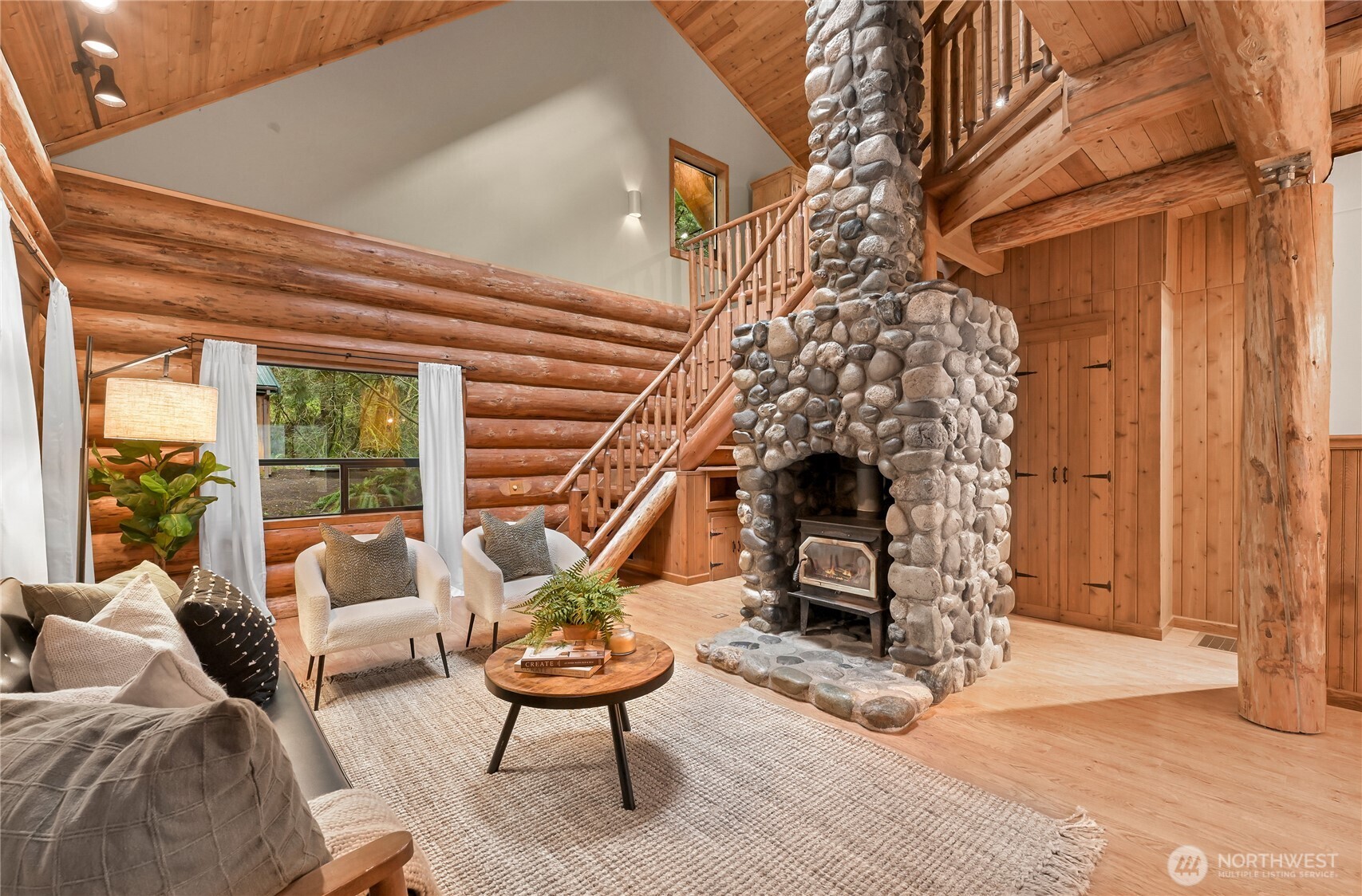 498 Summerland Road Bellingham, WA 98229 - Photo 9 of 40 a living room with furniture and a fireplace