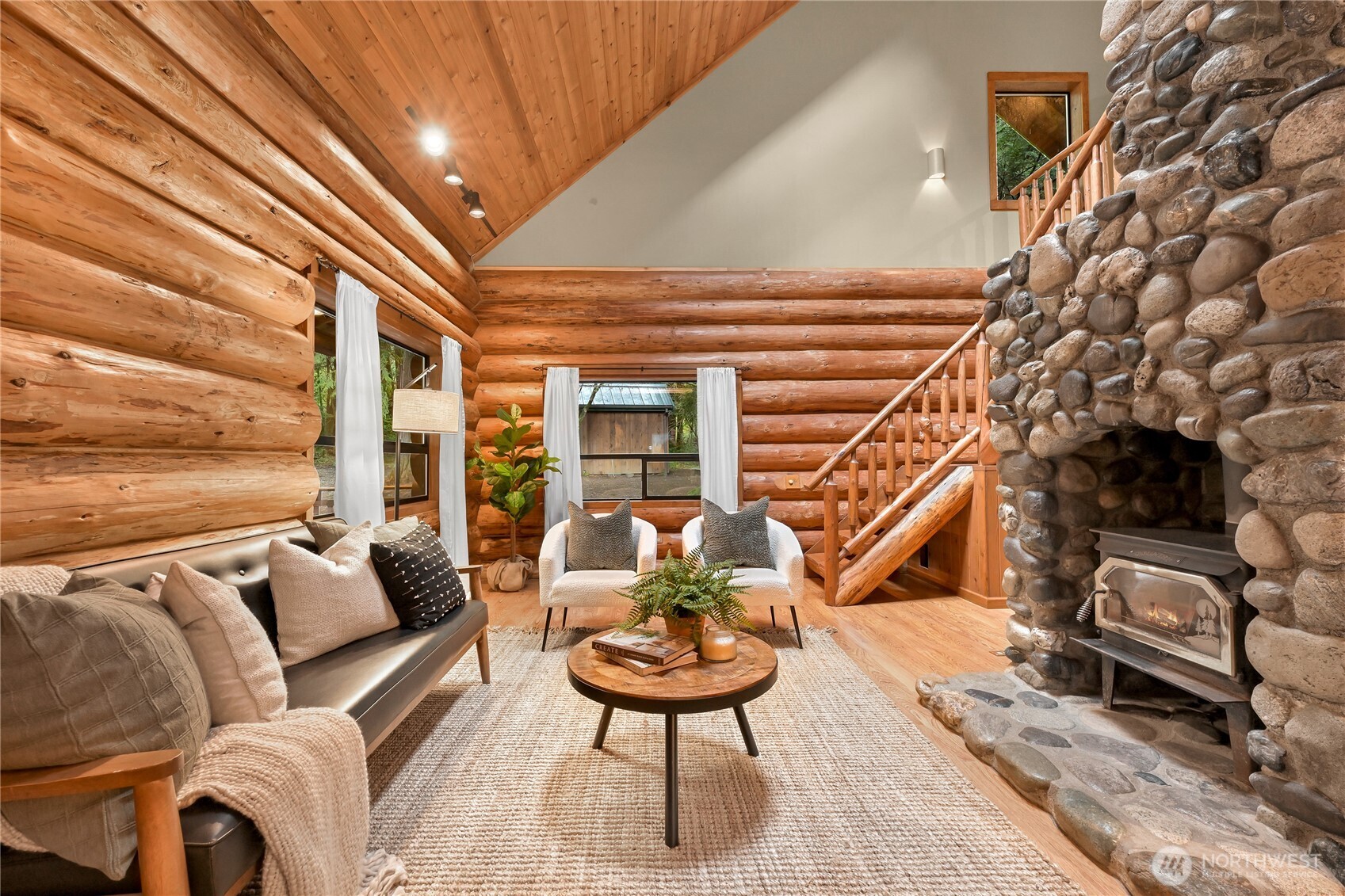 498 Summerland Road Bellingham, WA 98229 - Photo 10 of 40 a balcony with furniture and a potted plant