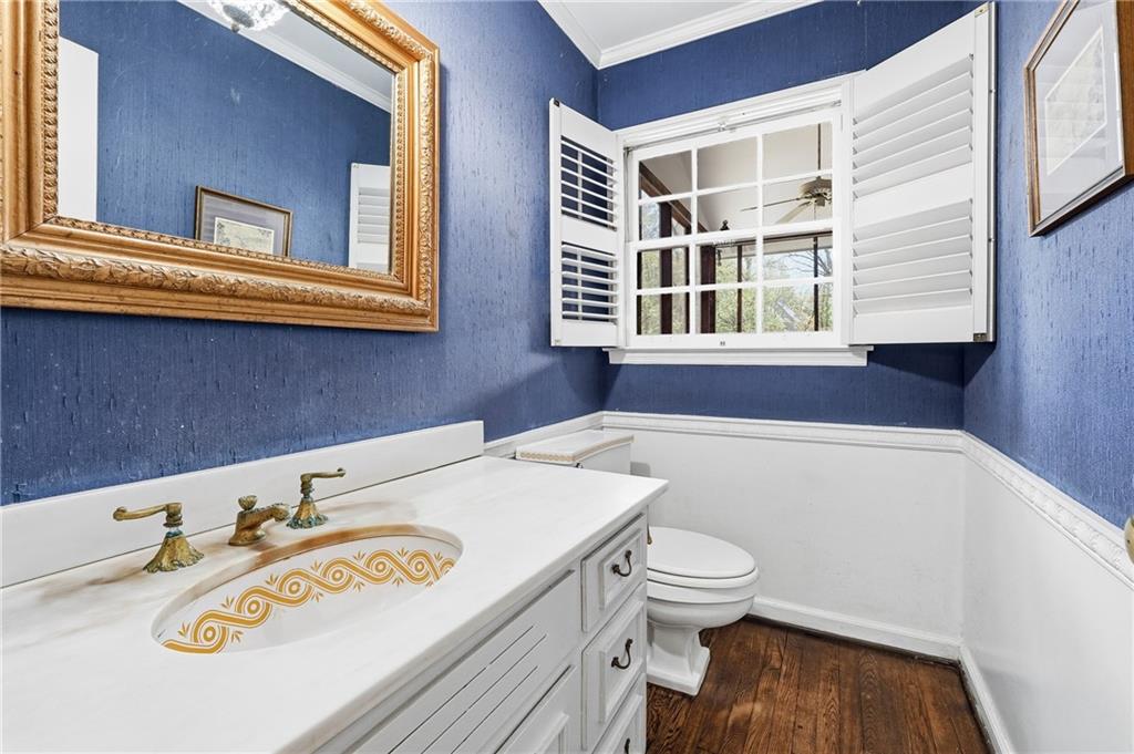 956 West Wesley Road Northwest Atlanta, GA 30327 - Photo 24 of 49 a bathroom with a sink a toilet and a window