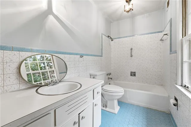 a bathroom with a sink a toilet and a bathtub