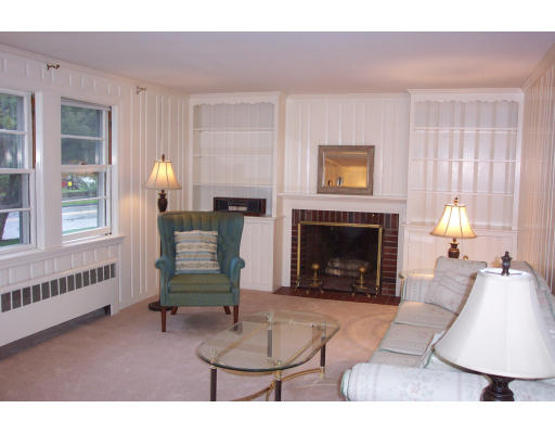 355 Webster Street Needham, MA 02494 - Photo 2 of 6 a living room with furniture and a fireplace