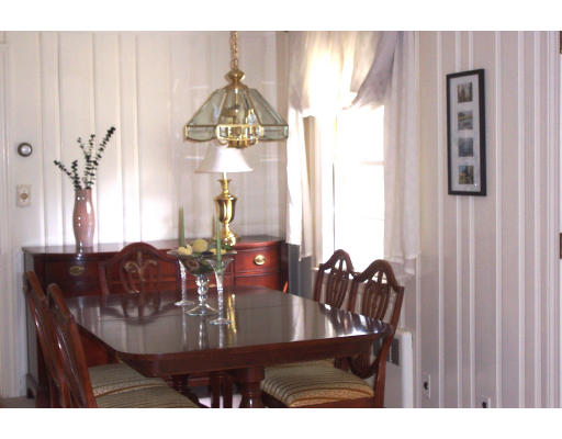 355 Webster Street Needham, MA 02494 - Photo 3 of 6 a view of a dining room with furniture and chandelier