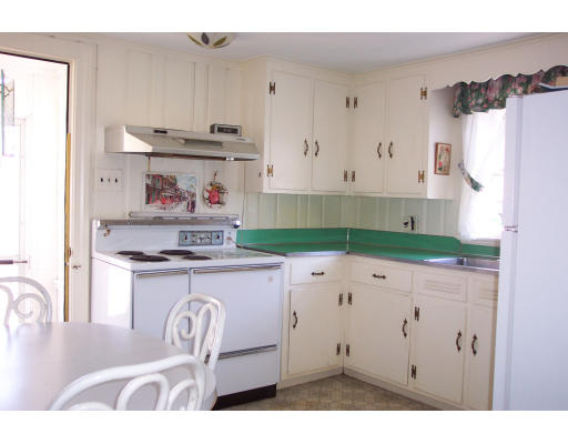 355 Webster Street Needham, MA 02494 - Photo 4 of 6 a kitchen with granite countertop a sink a stove and refrigerator