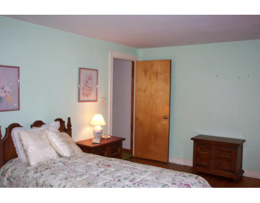 355 Webster Street Needham, MA 02494 - Photo 5 of 6 a bedroom with a bed window and a table