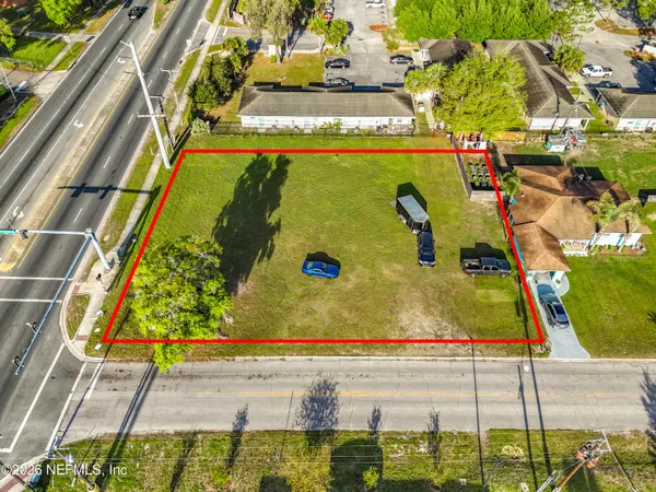 an aerial view of residential houses with outdoor space
