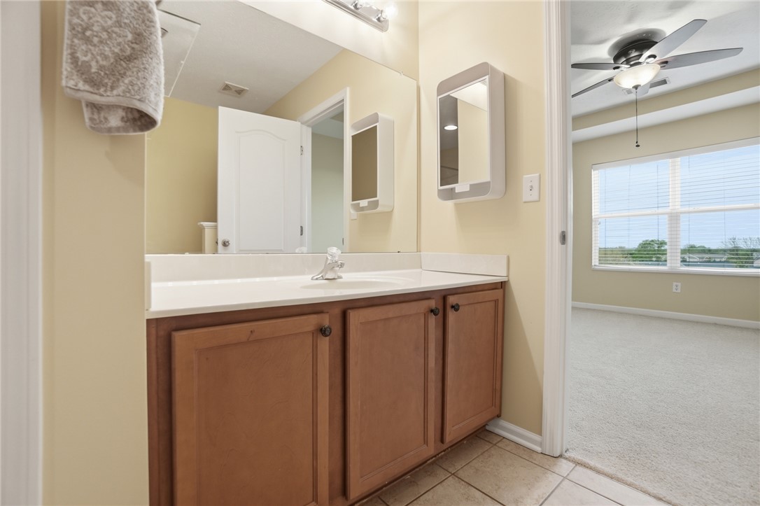 4324 Straight Arrow Road Dayton, OH 45430 - Photo 22 of 40 This bathroom features a functional vanity with ample storage and a clear, spacious mirror.