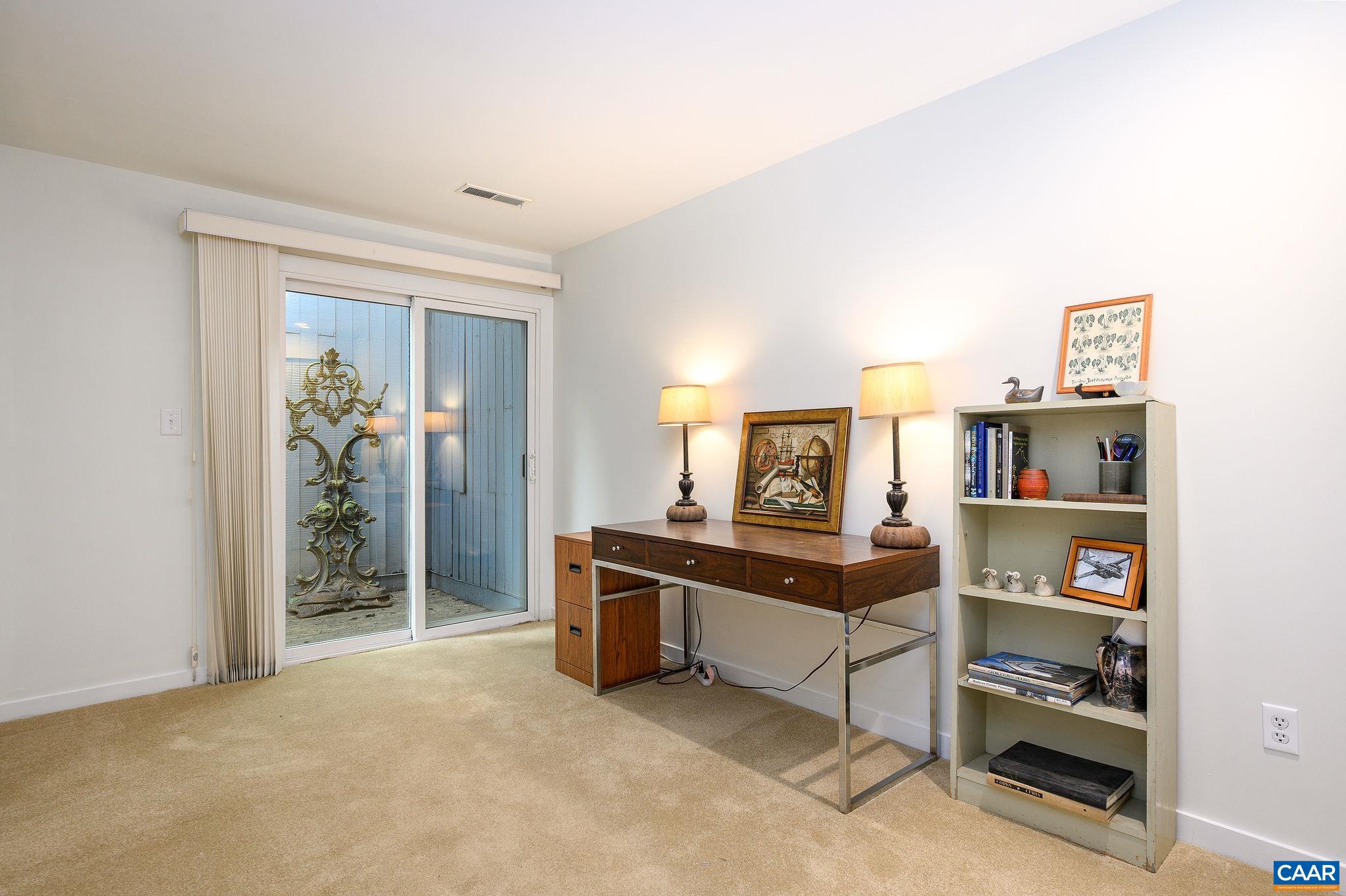 207 2nd Street Northwest, Unit D Charlottesville, VA 22902 - Photo 15 of 18 a view of a workspace with furniture
