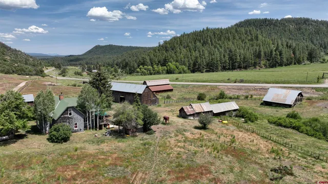 an aerial view of a house with mountain view