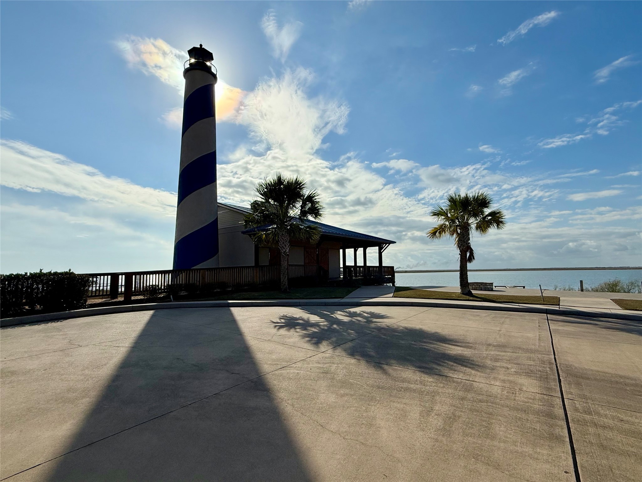 3060 Coastal Spgs Loop Palacios, TX 77465 - Photo 12 of 18 a street sign on a sidewalk next to a road